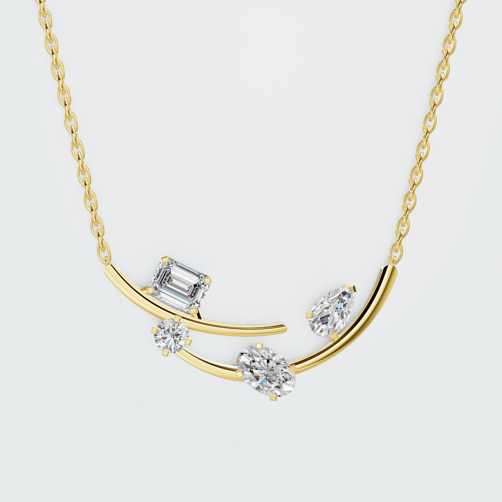 Emerald station necklace in yellow gold